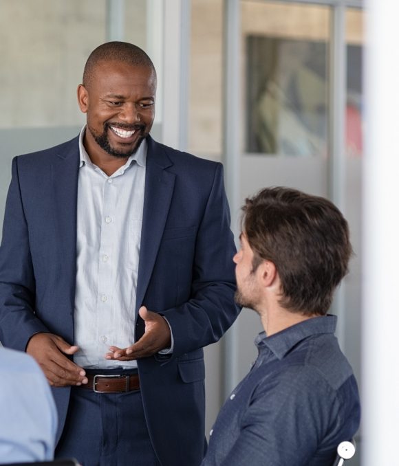 mature-business-man-in-meeting-smiling-2021-08-27-09-44-05-utc-Custom-pn74euke3xxz3pi990mfz5oumodjvhnymv5snfz5vg